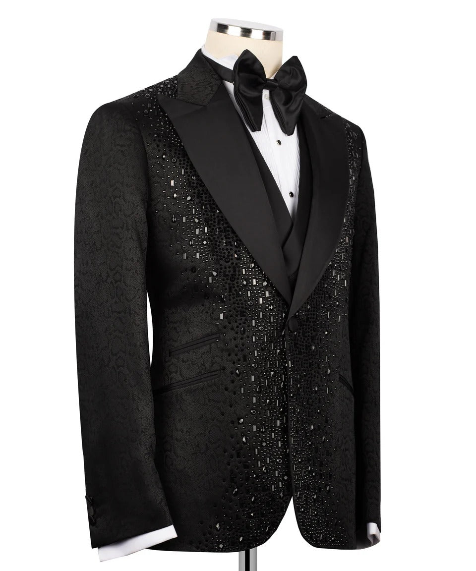 Black sequin tuxedo jacket on a mannequin with a white shirt and black bow tie.