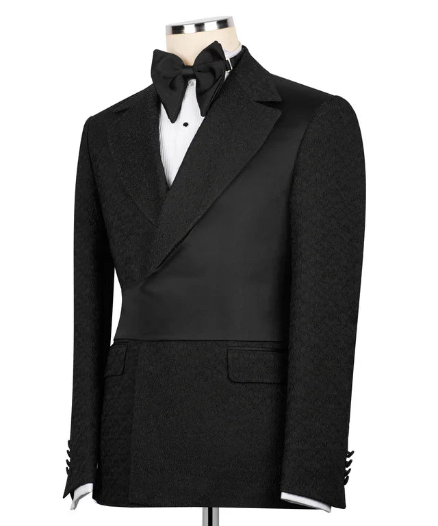 KOSS ATELIER black double-breasted tuxedo jacket on mannequin with satin waist panel and bow tie