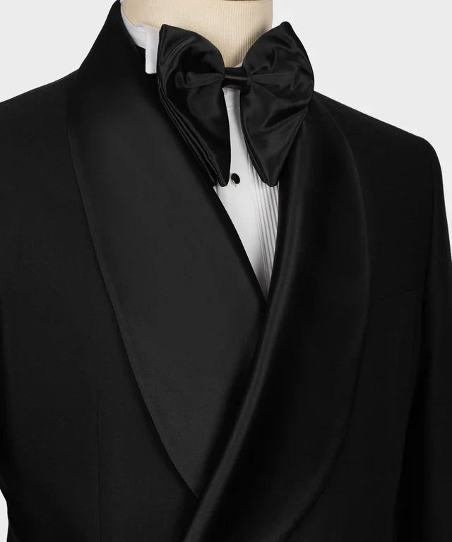 KOSS ATELIER black double breasted tuxedo with satin shawl lapel pleated white shirt and silk bow tie