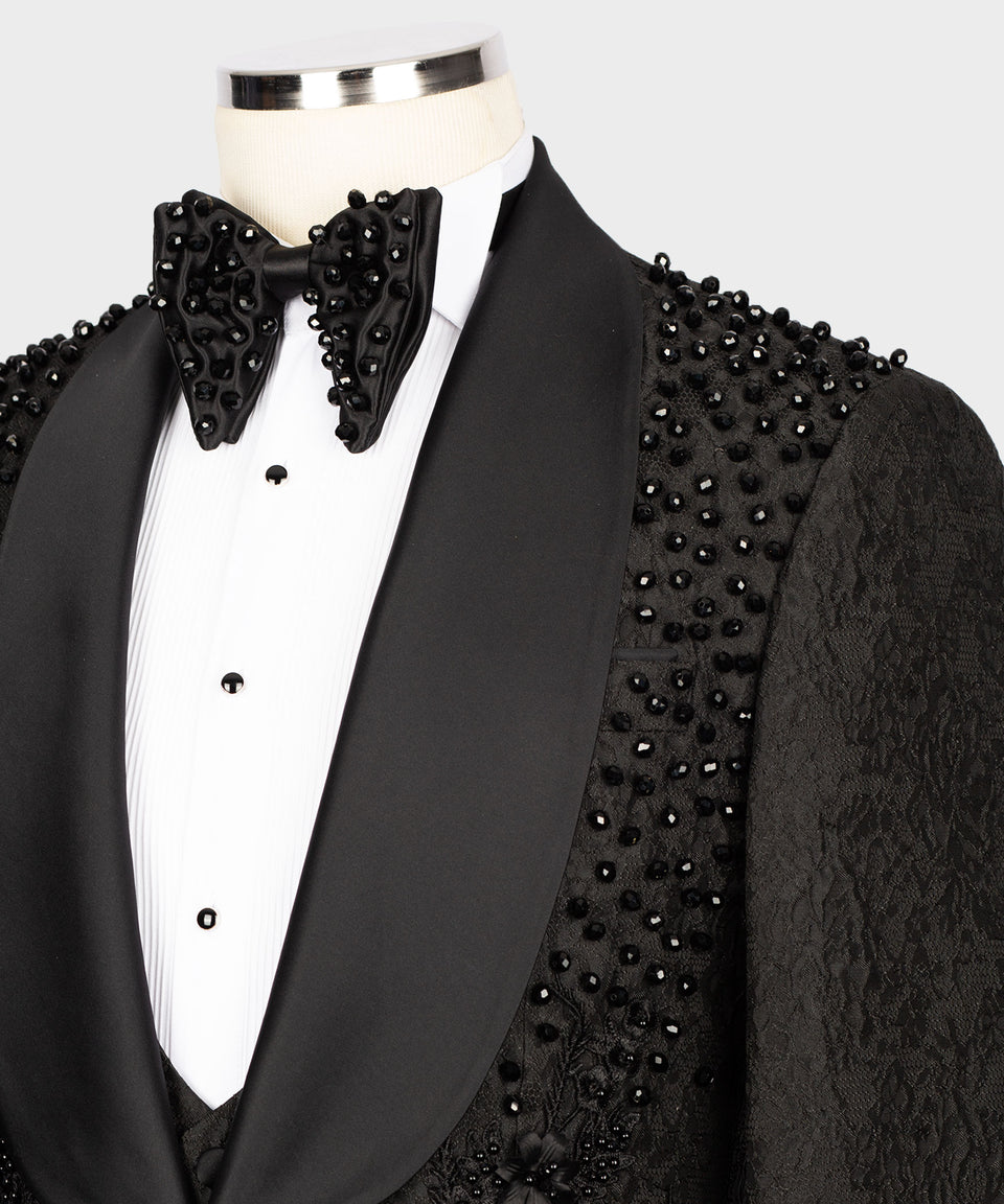 KOSS ATELIER handmade black beaded tuxedo on mannequin with satin shawl lapel and beaded bow tie