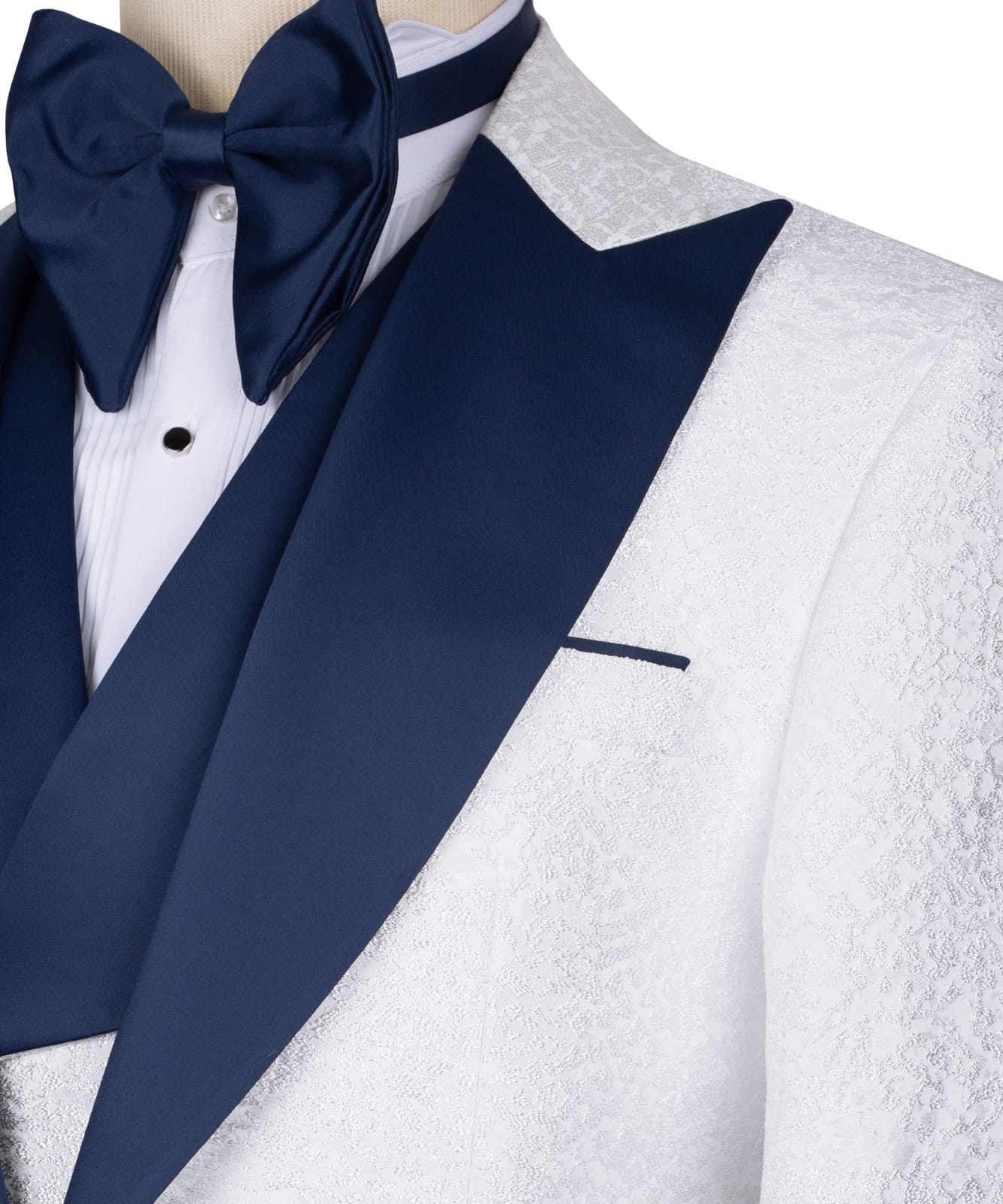 KOSS ATELIER white textured tuxedo for men with navy satin peak lapel and matching bow tie