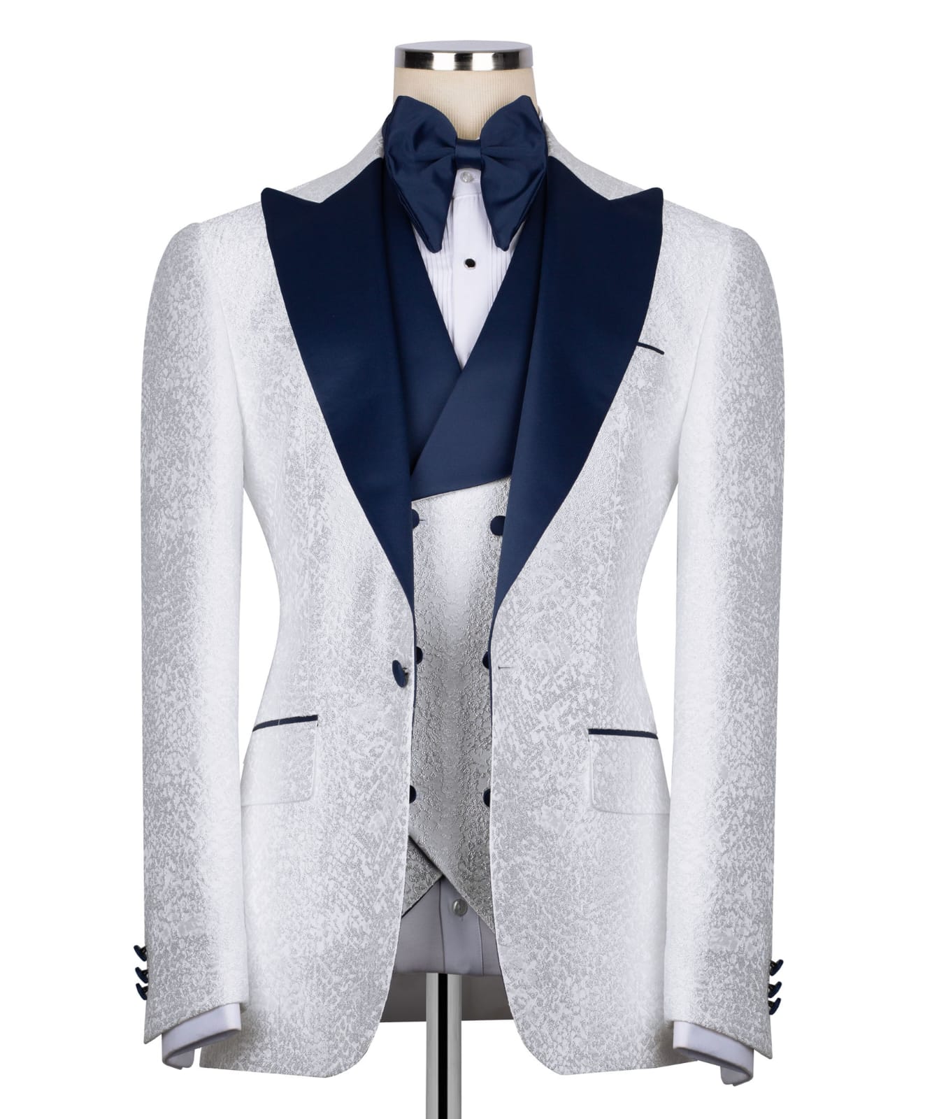 KOSS ATELIER white textured tuxedo for men with navy satin lapel bow tie and matching vest