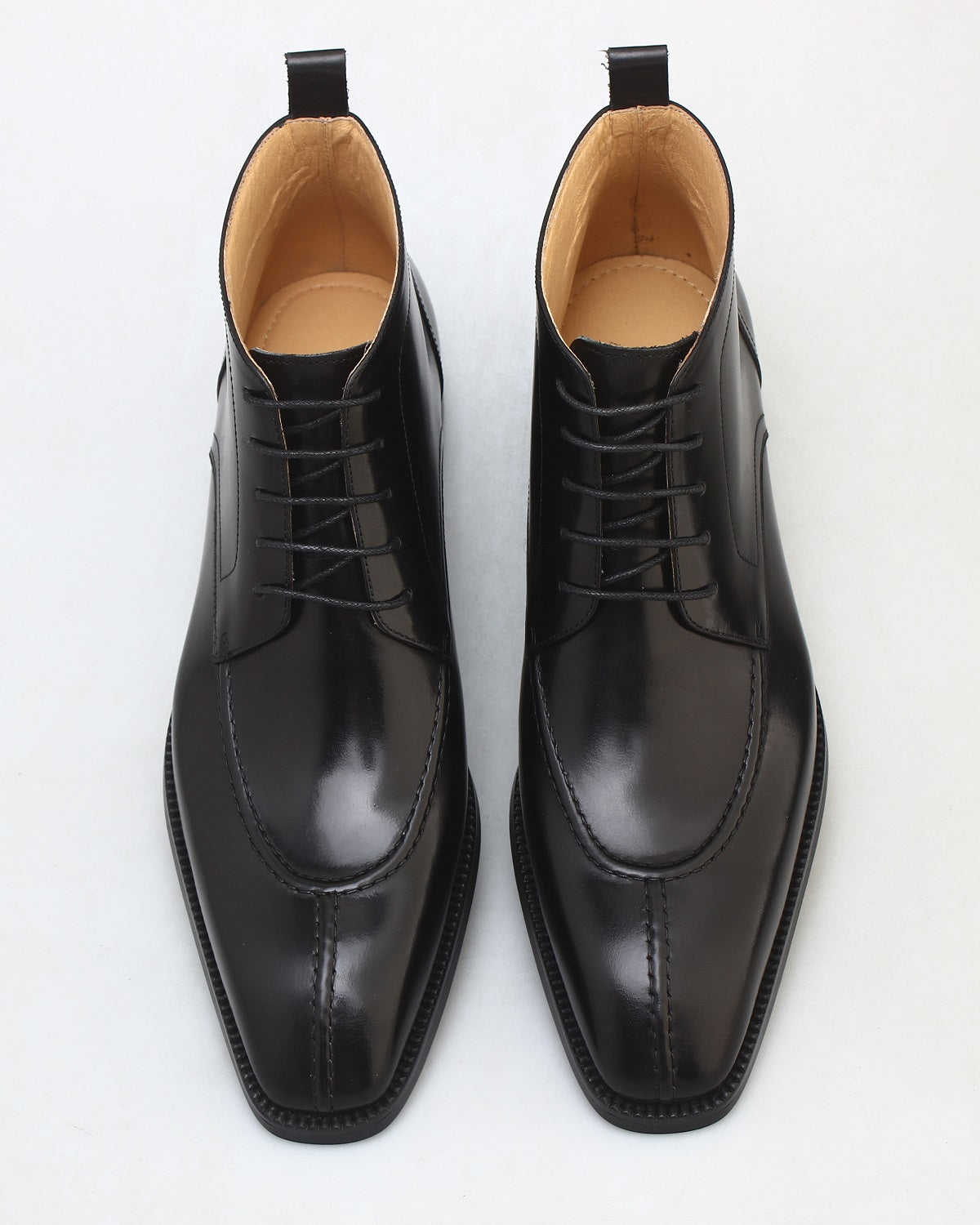 KOSS ATELIER Blackmore chukka boots polished black leather lace up ankle boots with tan lining top view