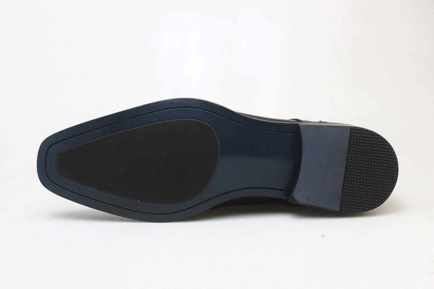 KOSS ATELIER Blackmore chukka boots sole view showing dark rubber outsole with textured heel and forefoot