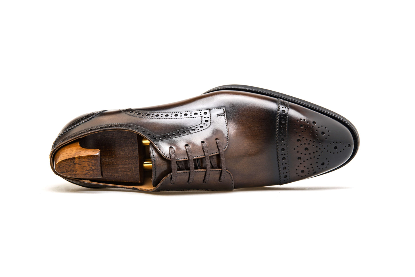 KOSS ATELIER brown cap-toe oxford shoes featuring intricate brogue detailing and a sleek design