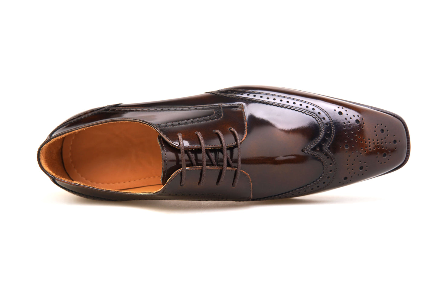 Brown patent wingtip oxford shoes with detailed brogue designs and polished finish
