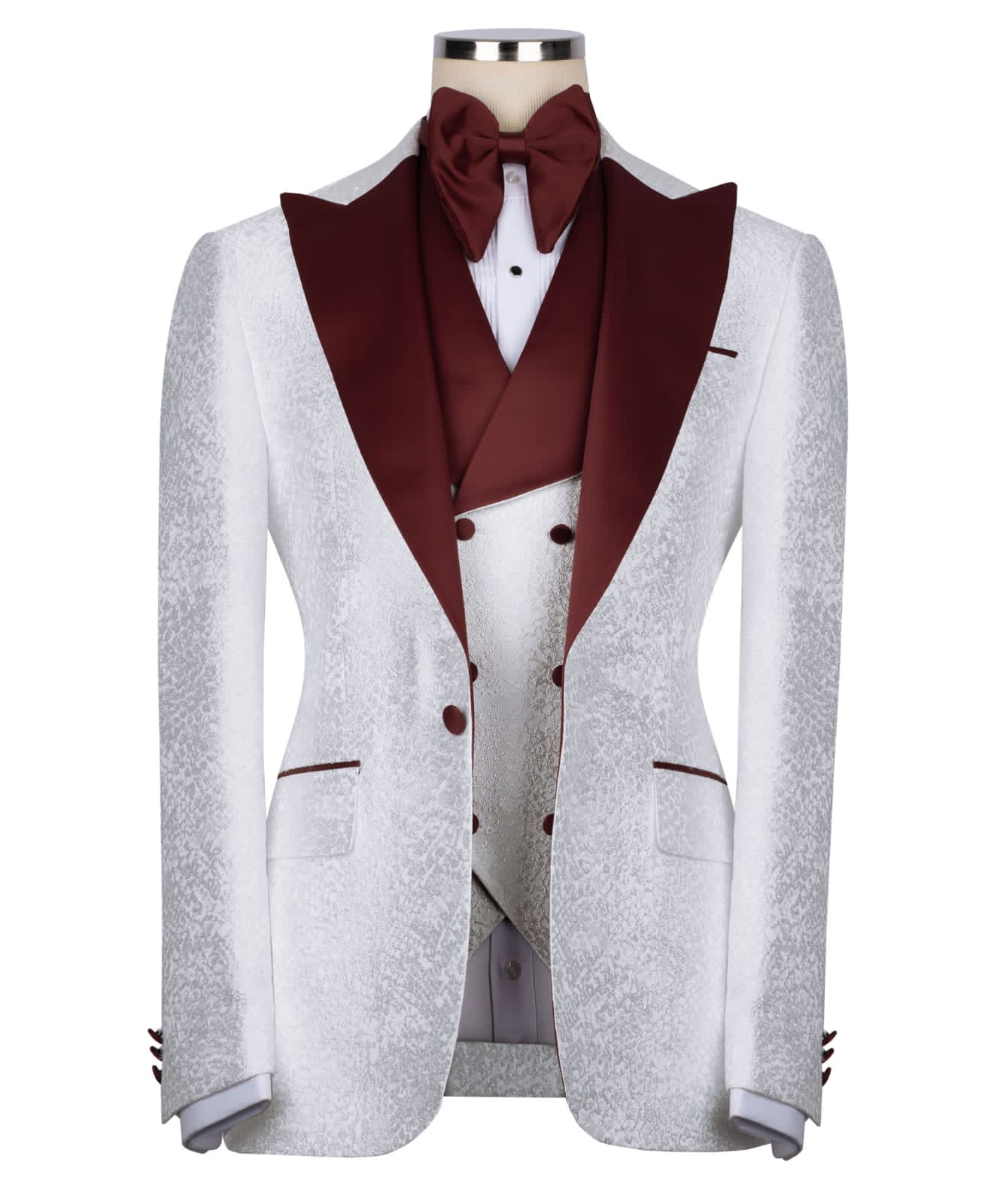 KOSS ATELIER white textured tuxedo for men with burgundy satin shawl lapel vest and bow tie on mannequin