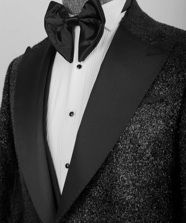 KOSS ATELIER Black Glitter Classic Tuxedo close up showing satin shawl lapel glitter jacket pleated white shirt and bow tie