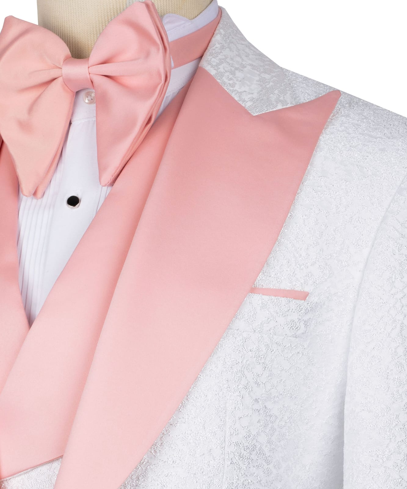 KOSS ATELIER white textured tuxedo for men with pink satin shawl lapel and matching pink bow tie close up