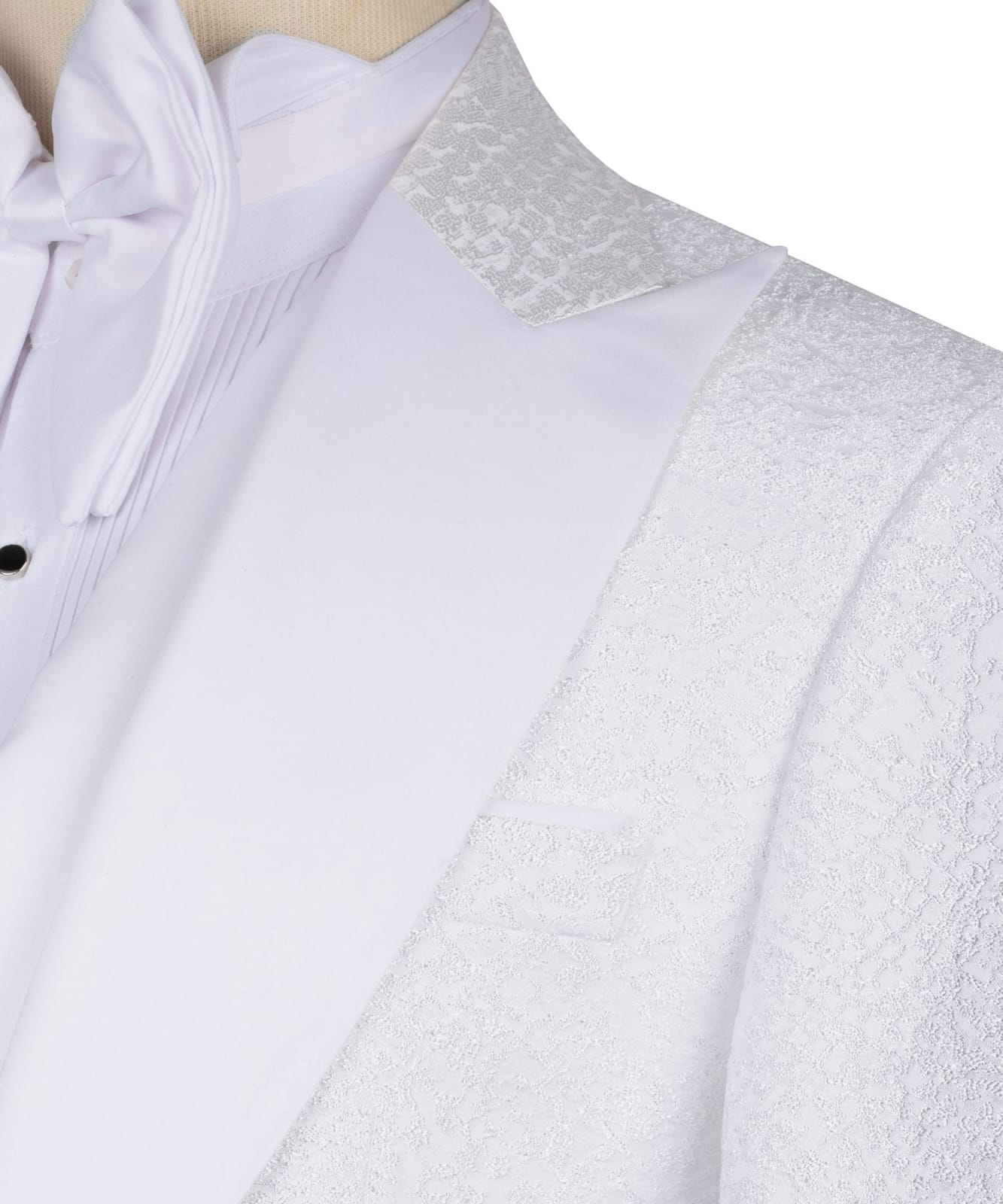 KOSS ATELIER white textured tuxedo for men close up showing textured shawl lapel pocket pleated shirt and bow tie