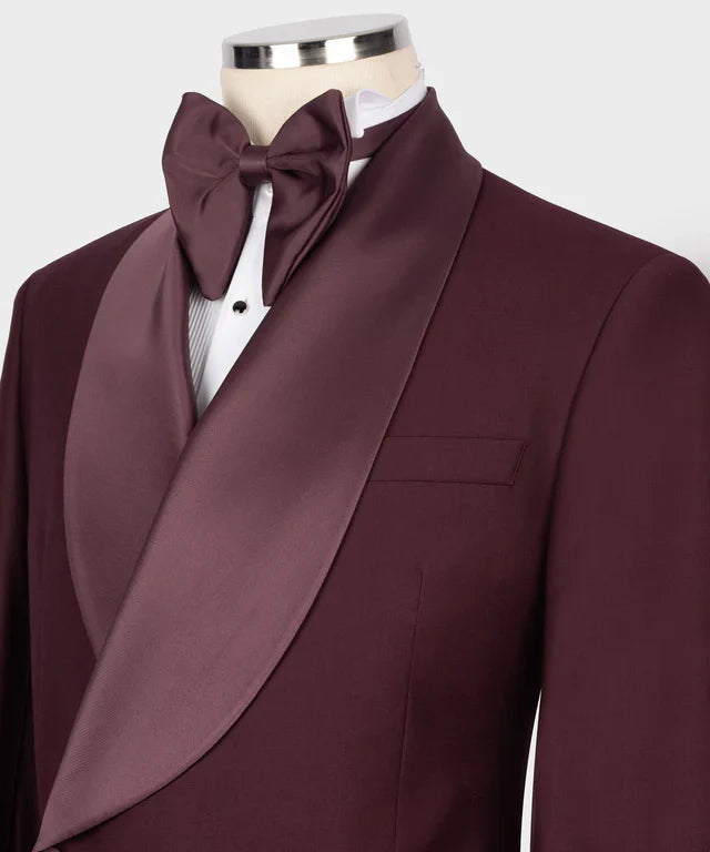 KOSS ATELIER burgundy double breasted tuxedo with satin shawl lapel and matching bow tie on mannequin