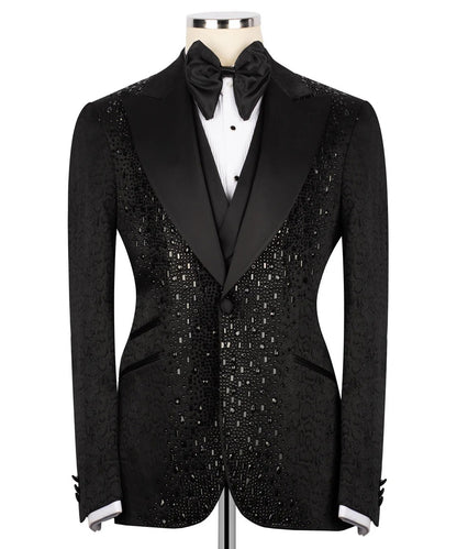 Black tuxedo with sequin details on a mannequin against a white background