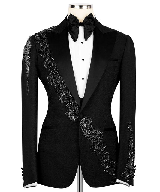 Black tuxedo with floral embroidery on a white background