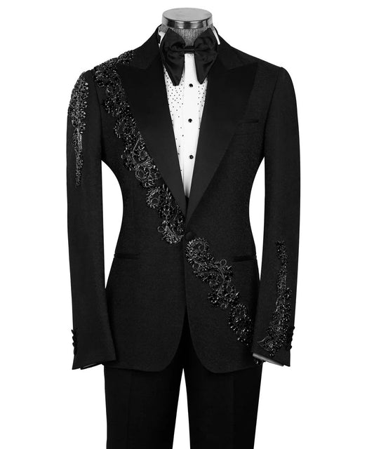 Black tuxedo with floral embellishments on a mannequin against a white background
