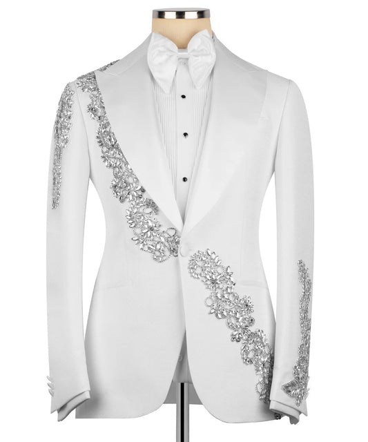 White tuxedo with decorative embellishments on a mannequin
