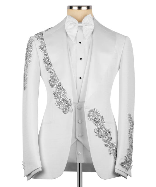 White tailcoat with silver embellishments on a mannequin