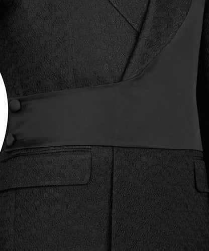 KOSS ATELIER black double-breasted tuxedo close up showing textured jacquard fabric shawl lapel waist sash and flap pockets
