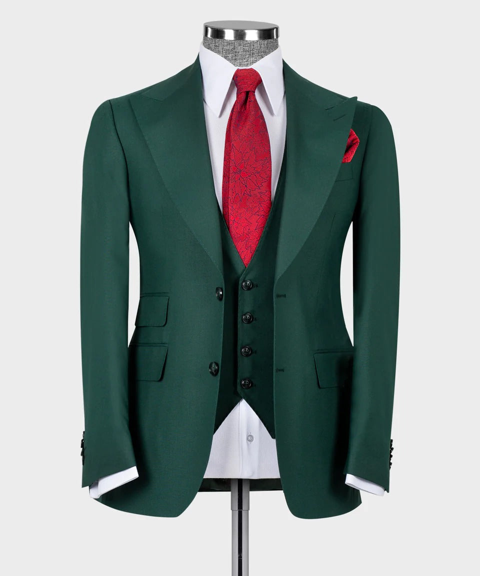 KOSS ATELIER dark green 3-piece suit on mannequin with matching vest white shirt red tie and pocket square