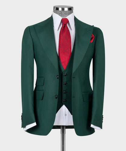 KOSS ATELIER dark green 3-piece suit on mannequin with matching vest white shirt red tie and pocket square