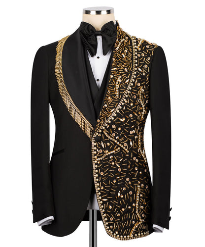 KOSS ATELIER handmade black tuxedo with gold details embroidered right panel and gold fringe shawl lapel on mannequin