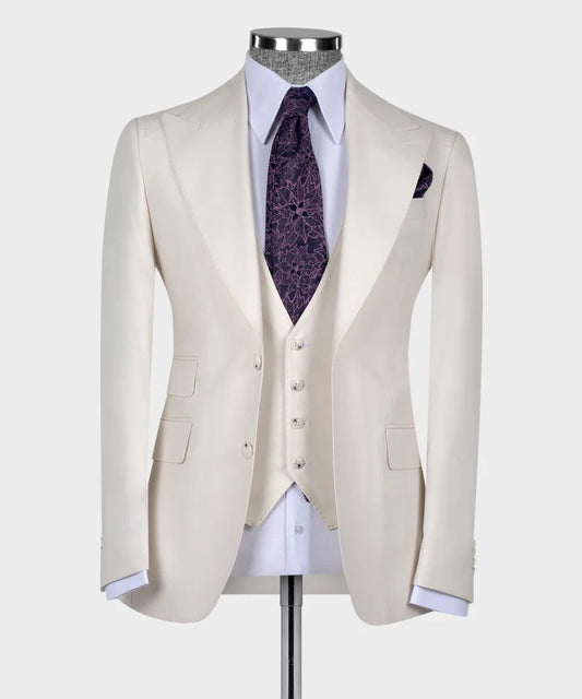 KOSS ATELIER ivory 3-piece suit for men on mannequin with white shirt and purple patterned tie