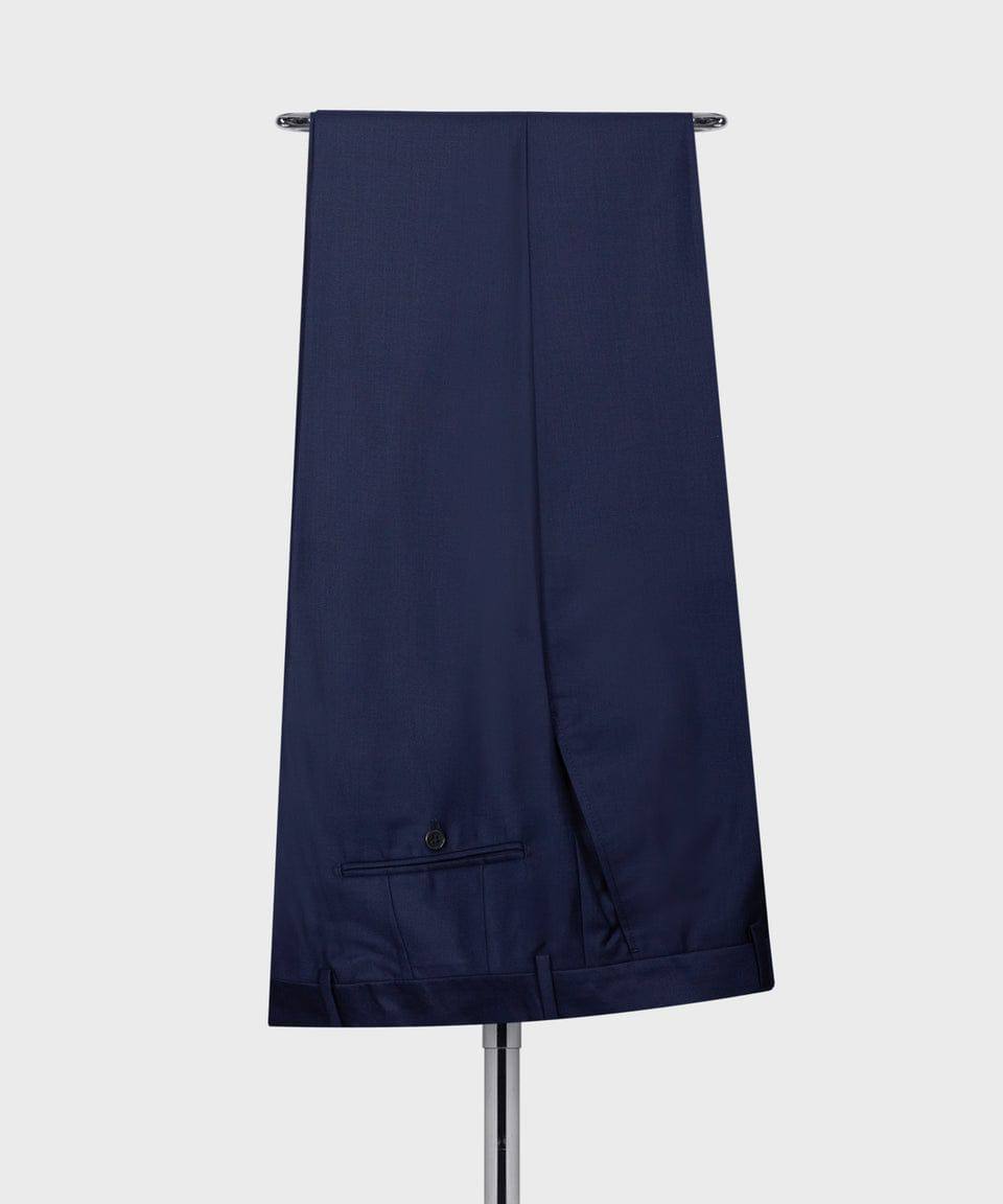 KOSS ATELIER men's navy three-piece suit trousers draped on hanger showing back pocket and hem