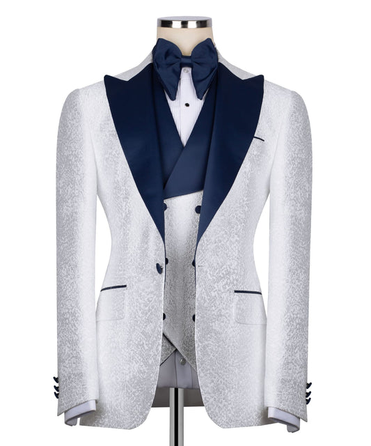KOSS ATELIER white textured tuxedo for men with navy satin lapel bow tie and matching vest
