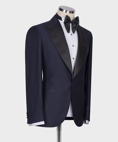 KOSS ATELIER Classic Dark Blue Tuxedo with satin peak lapel single button jacket and black bow tie on mannequin