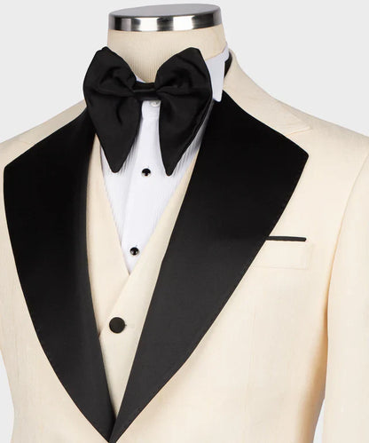 KOSS ATELIER cream tuxedo with black satin collar on mannequin with black bow tie and cream waistcoat