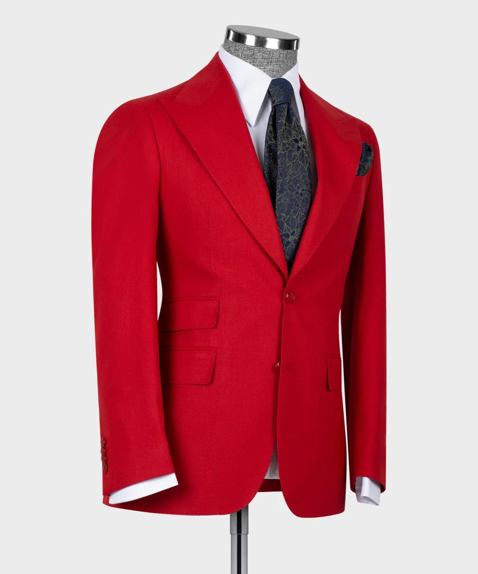 KOSS ATELIER crimson red 3-piece suit for men. Tailored jacket on mannequin with white shirt and navy patterned tie