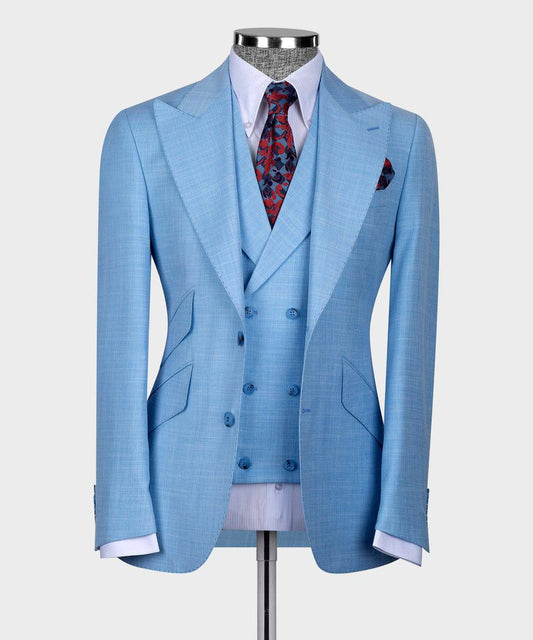 KOSS ATELIER sky blue three-piece suit for men on mannequin with double breasted vest and patterned tie
