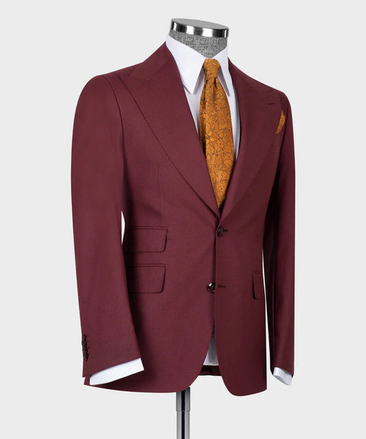 KOSS ATELIER maroon three piece suit for men displayed on mannequin with white shirt and gold patterned tie