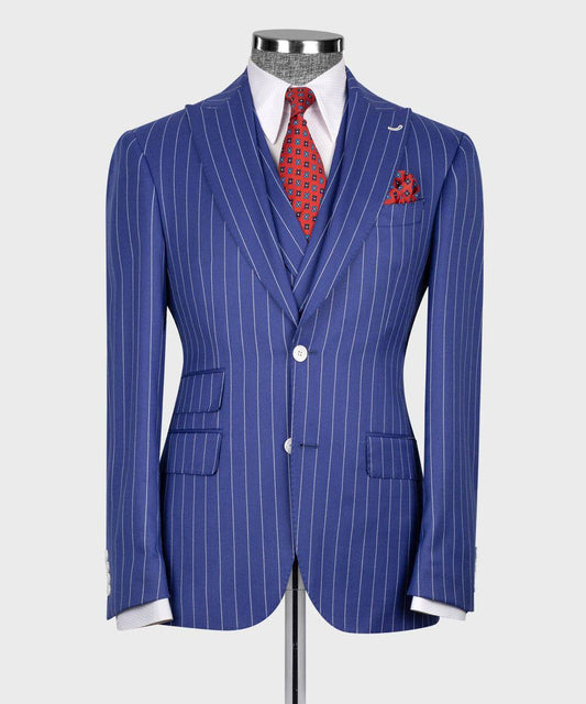 KOSS ATELIER blue pinstripe suit for men on mannequin with white shirt red patterned tie and pocket square
