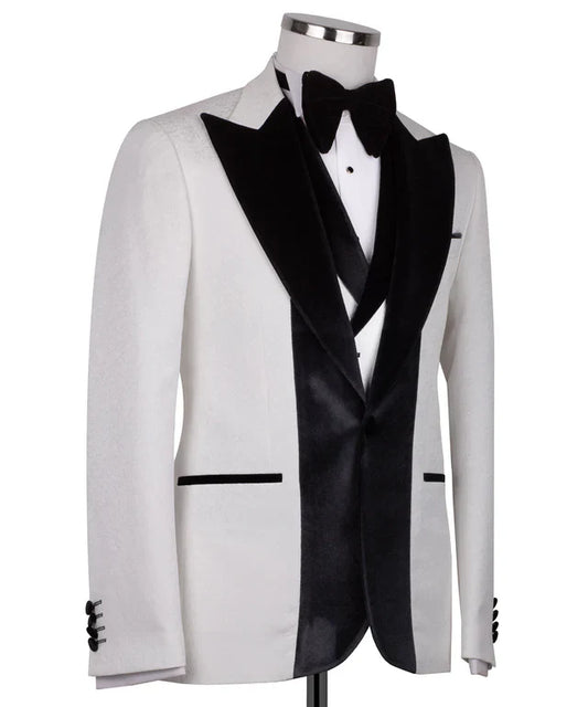 KOSS ATELIER white velvet tuxedo with black collar on mannequin featuring black shawl lapel and bow tie