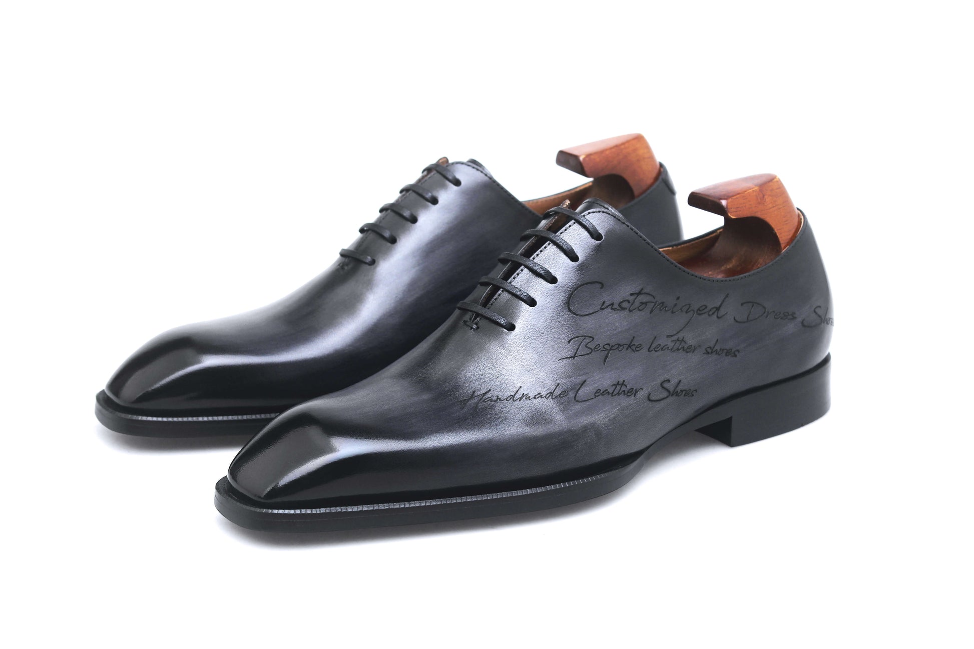 KOSS ATELIER black patina dress shoes with a sleek design and handcrafted leather finish