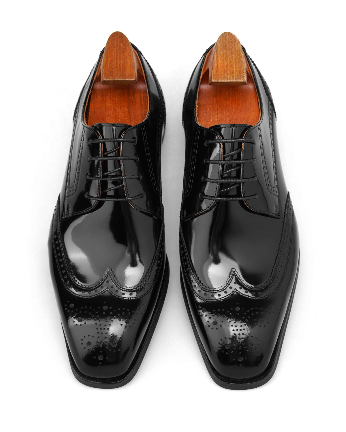 KOSS ATELIER black wingtip oxford shoes with polished finish and elegant design