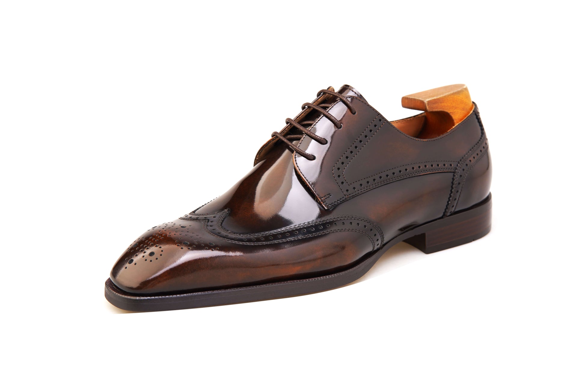 Brown patent wingtip oxford shoes by KOSS ATELIER featuring classic design and sleek finish