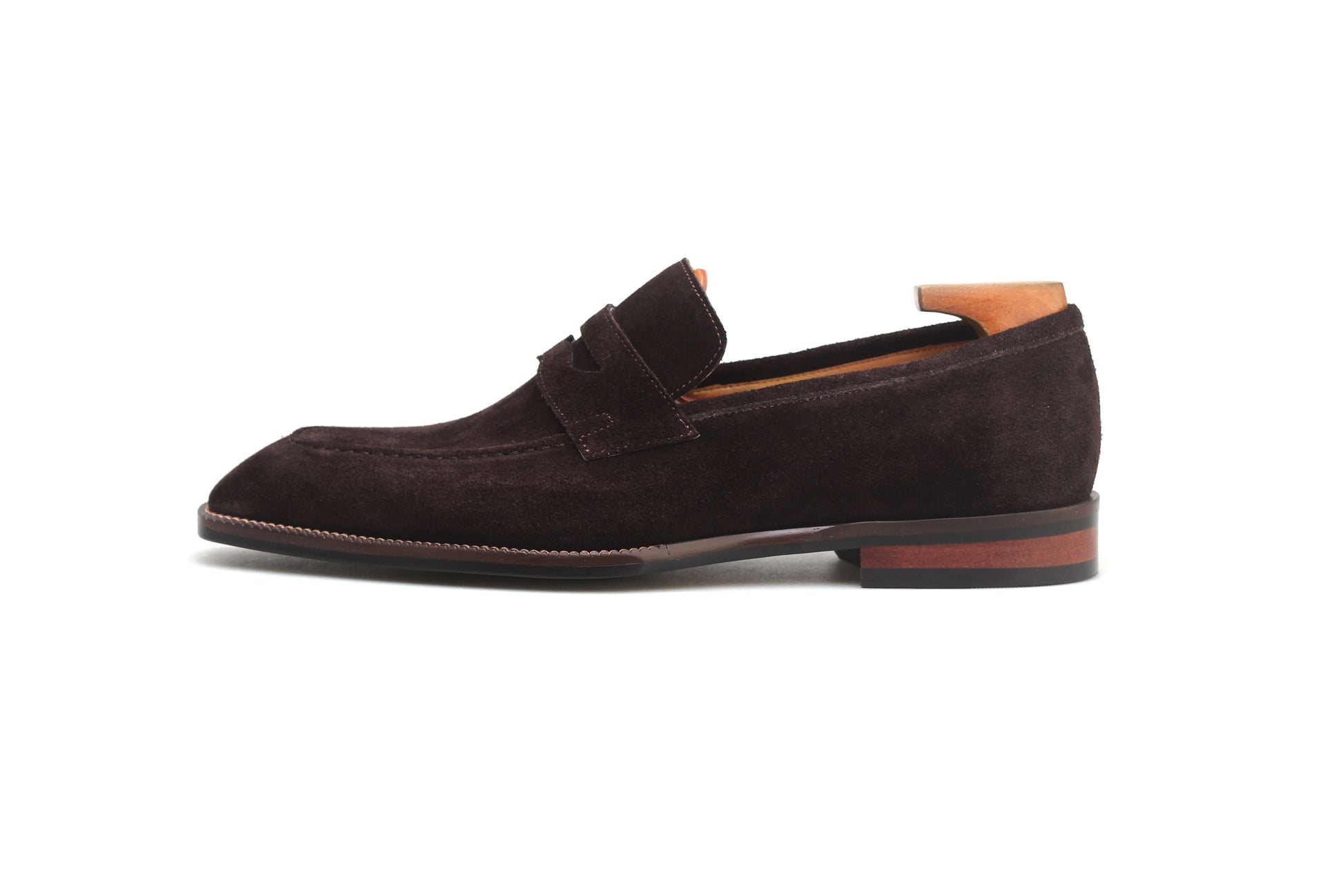 Elegant brown suede shoes with wood detail, perfect for formal occasions and stylish outings