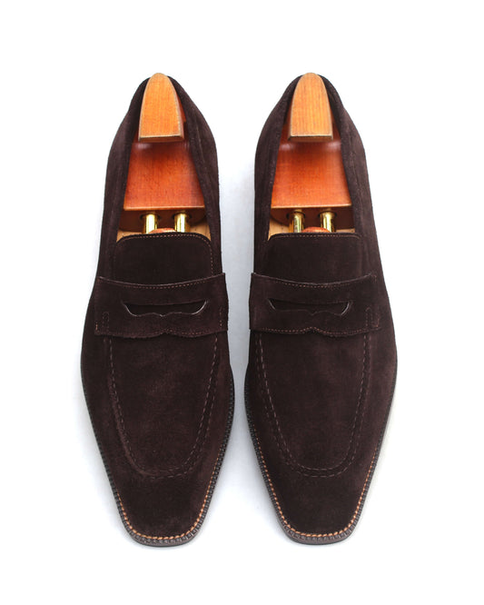 Brown suede shoes with wood detail featuring a stylish bow design and elegant finish