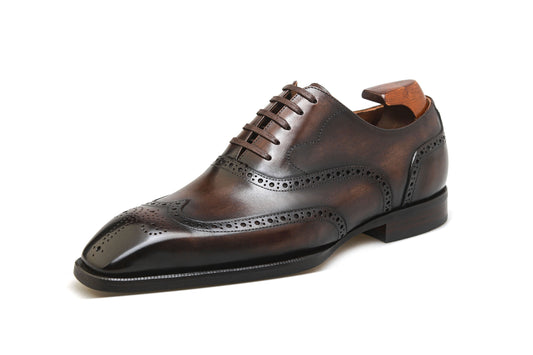 KOSS ATELIER chocolate brown wingtip shoes with intricate brogue detailing and polished finish