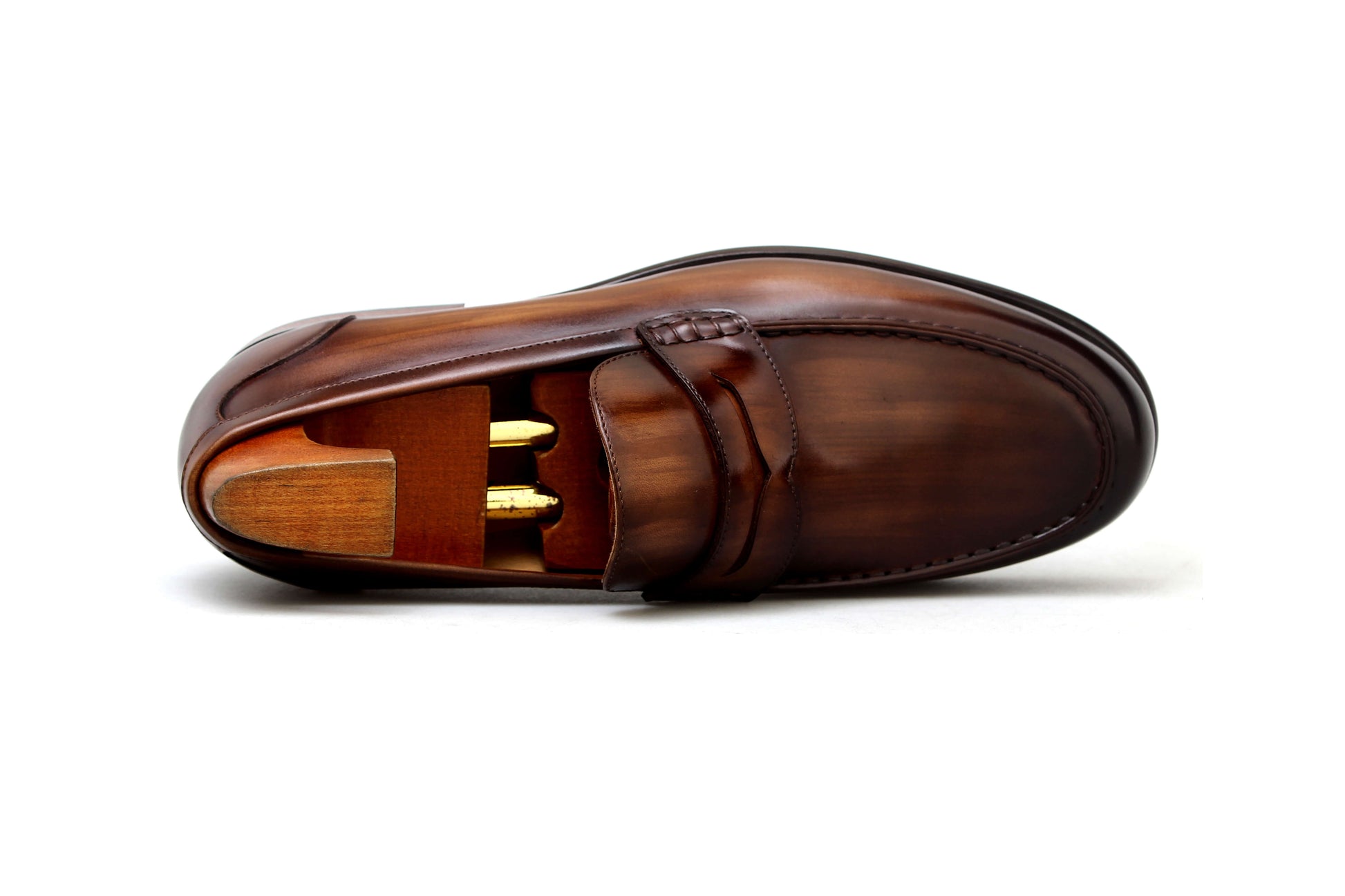 Classic brown penny loafers men with polished leather and shoe trees for a refined look