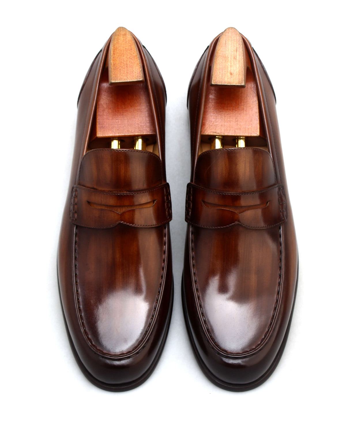 Classic brown penny loafers men with a sleek and polished finish for versatile styling