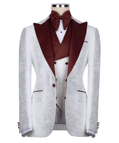 KOSS ATELIER white textured tuxedo for men with burgundy satin shawl lapel vest and bow tie on mannequin