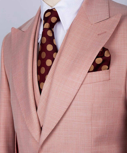 KOSS ATELIER men's rose pink three-piece suit close up with white shirt burgundy polka dot tie and pocket square