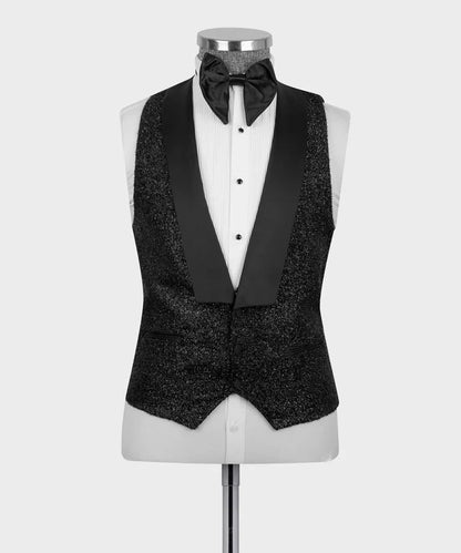 KOSS ATELIER Black Glitter Classic Tuxedo vest with satin shawl lapel and matching bow tie on mannequin