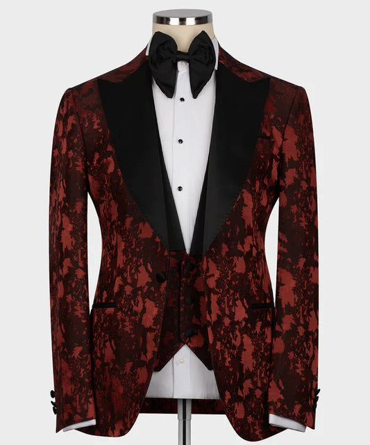 KOSS ATELIER burgundy tuxedo for men with black satin shawl lapel floral jacquard pattern and bow tie