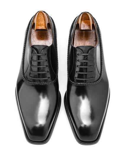 Elegant black Balmoral oxfords with a glossy finish and classic design for formal occasions