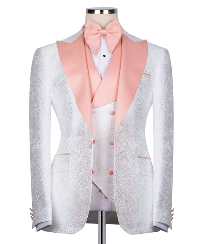 KOSS ATELIER white textured tuxedo for men with blush pink satin shawl lapel vest and bow tie on mannequin