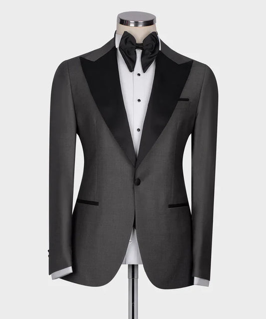 KOSS ATELIER Classic Dark Gray Tuxedo with black satin peak lapel single button and bow tie on mannequin