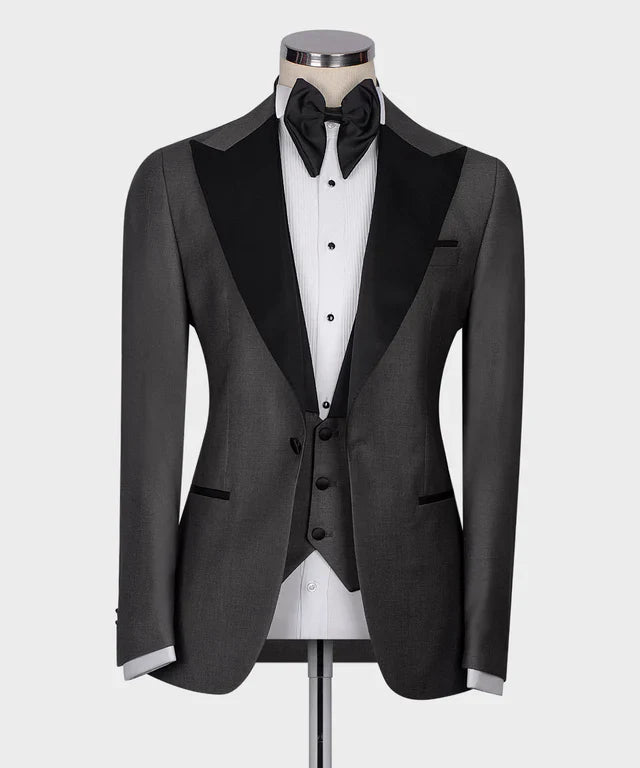 KOSS ATELIER Classic Dark Gray Tuxedo with black satin peak lapels matching vest and bow tie on mannequin